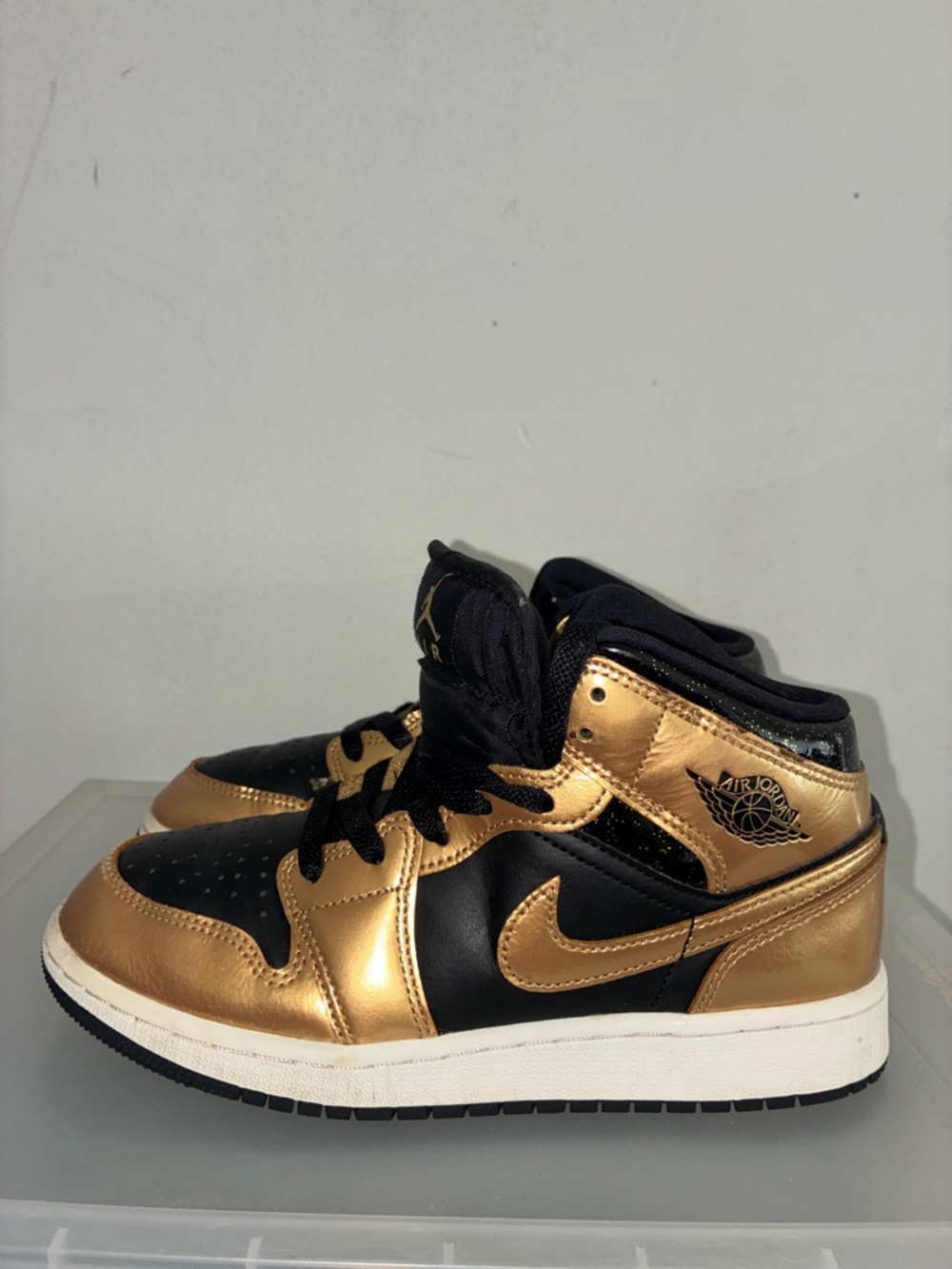 Jordan Kids Black and Gold Sneakers
